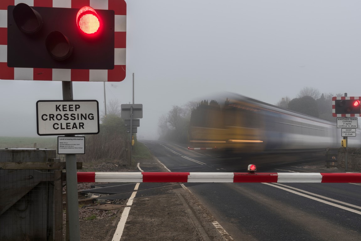 04 Commuter train at level crossing.jpg