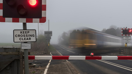 04 Commuter train at level crossing.jpg